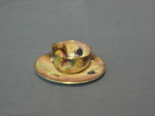 A modern Royal Worcester miniature cup and saucer with fruit decoration