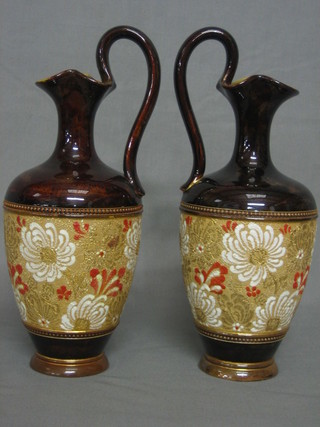 A pair of Royal Doulton brown glazed ewers, the base marked Doulton Lambeth England 8938 11"