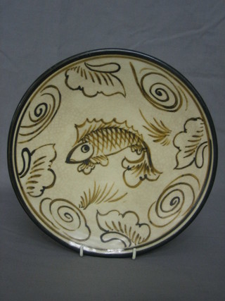 A 17th/18th Century Oriental pottery plate decorated a fish 9"