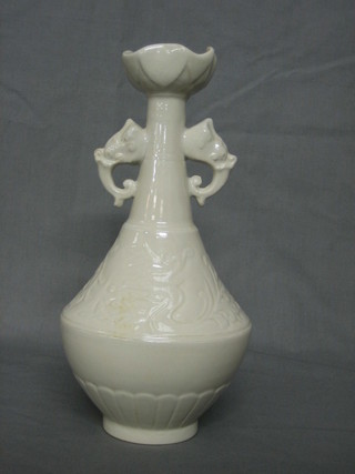An Oriental blanc de chine porcelain twin handled vase with elephant handles 10", the base with signature 10"
