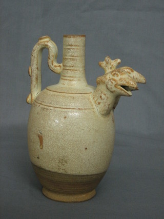 An Oriental light brown glazed pottery bottle jug with twin bird head spout 7"