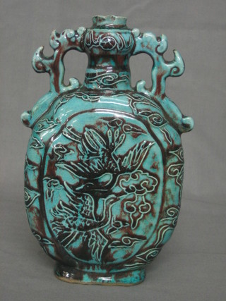 An 18th/19th Century Oriental turquoise glazed twin handled bottle shaped vase decorated dragons 9"
