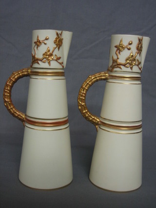 A pair of Royal Worcester blush ivory ground waisted vases with gilt decoration, the base with purple Worcester mark, marked 1047 10"