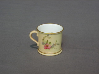 A Royal Worcester blush ivory ground miniature mug with floral decoration, the base with green Worcester mark and 14 dots, 2"
