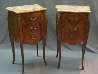 A pair of 20th Century French Kingwood bedside cabinets with shaped pink veined marble tops, each fitted 3 graduated drawers 17"