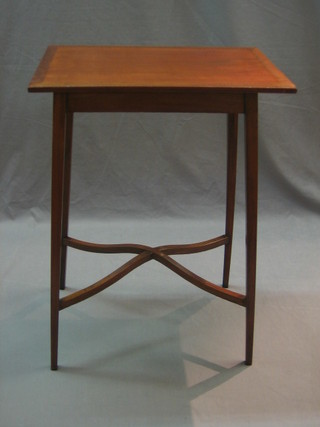 An Edwardian rectangular mahogany occasional table raised on square supports with H framed stretcher 20"