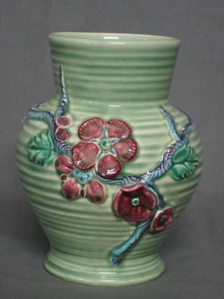 A Clarice Cliff green and red glazed vase with floral decoration, the base signed Clarice Cliff 7"