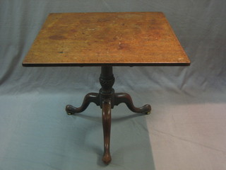 A 19th Century rectangular mahogany snap top tea table, raised on a turned column and tripod base 30"