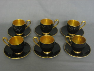A set of 6 Carltonware black glazed coffee cups and saucers  with gilt interior (6 saucers cracked and 1 cup cracked)