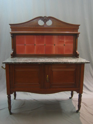 An Edwardian walnut wash stand with blank veined marble top and pink tiled splash back, raised on turned supports 42"