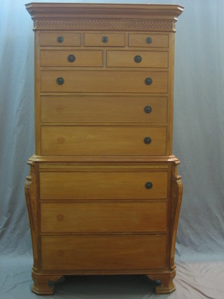 A 20th Century mahogany Georgian style chest on chest with moulded cornice, blind fret work frieze and canted corners,  the upper section fitted 3 short drawers above 3 long drawers, the base fitted a brushing slide above 3 long drawers, raised on ogee bracket feet 38"