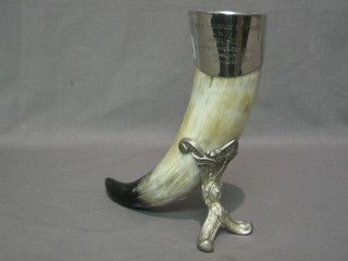A horn and pewter table ornament in the form of a horn, engraved The Worshipful Company of Hornerers to S John Holt in grateful recognition of his years as Worshipful Clark 1992 - 1998