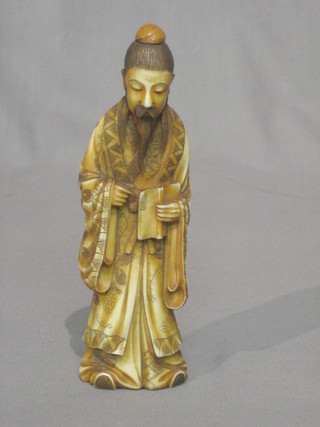 A carved ivory figure of a standing sage 6"