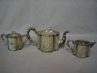 An Oriental oval embossed silver 3 piece tea service with  teapot, twin handled sugar bowl and cream jug 24 ozs (teapot lid f)