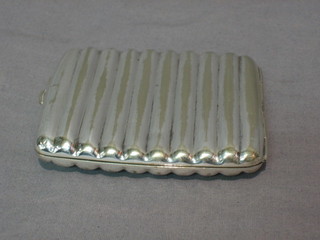 A ribbed silver plated cigarette case