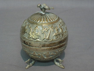 An Eastern embossed silver globular shaped jar and cover raised on 3 feet 4", 4 ozs