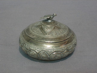 An Eastern silver circular squat jar and cover, the finial in the form of a bird, 1 ozs