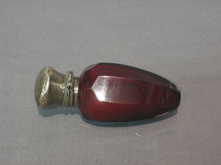 A Victorian red faceted glass scent bottle with silver lid 3"