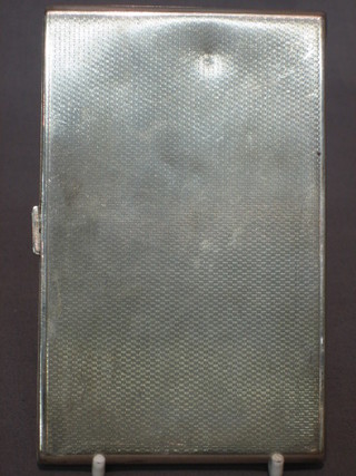 An Art Deco silver cigarette case with engine turned decoration Birmingham 1934 with Jubilee hallmark, 7 ozs