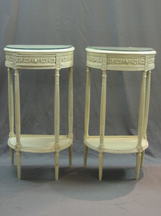 A pair of Edwardian Continental white painted carved mahogany bedside tables, fitted drawers raised on turned and fluted supports with undertier 18"