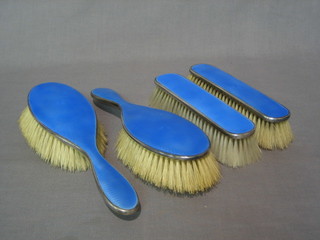 An Art Deco silver and blue enamelled back  4 piece dressing table set comprising 2 hair brushes, 2 clothes brushes, Birmingham 1926