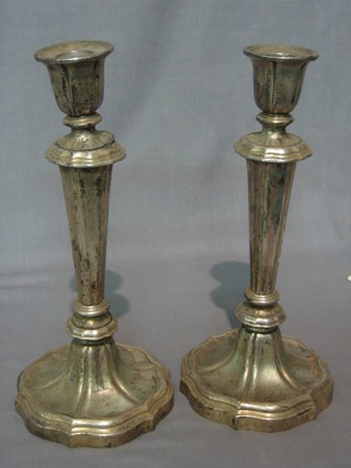 A pair of silver plated candlesticks 11"