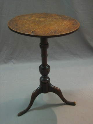 An 18th/19th Century circular snap top wine table raised on a turned column and tripod support 18"
