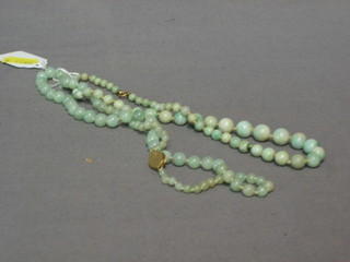 2 strings of green hardstone beads