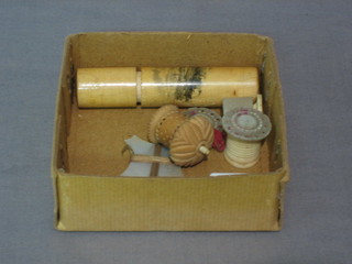 A Victorian wooden needle case decorated Douglas, an ivory cased tape measure, 1 other (f), a Victorian ivory  cotton reel and 2 other cotton reels