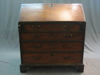 A Georgian mahogany bureau with fall front revealing a well fitted interior above 4 long graduated drawers, raised on bracket feet 38"