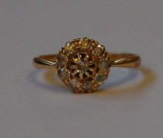 A lady's 18ct gold cluster design dress ring set numerous diamonds