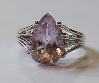 A lady's 9ct white gold dress ring set a heart cut amethyst