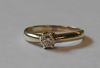 A lady's gold dress/engagement ring set a solitaire diamond