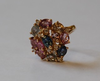 A lady's gold dress ring set natural sapphires and diamonds