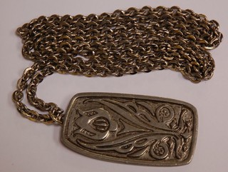 A Georg Jensen pewter pendant with floral decoration, the reverse marked pewter Georg  Jensen Denmark 118, hung on a silver curb chain