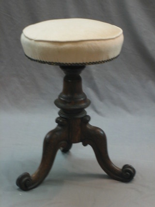 A William IV rosewood adjustable piano stool raised on a tripod column