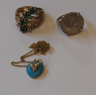 A gold dress ring set white and blue stones, an enamelled heart shaped pendant set pearls and a sixpence ring