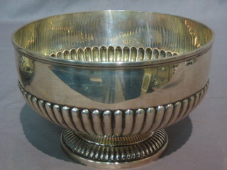 A circular silver rose bowl with demi-reeded decoration, raised on spreading foot, Sheffield 1919 by Mappin & Webb, 17 ozs, inscribed