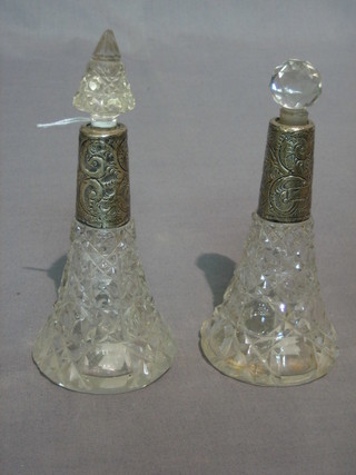 A pair of waisted cut glass perfume bottles with silver collars 5"