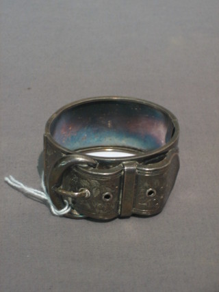 A silver bracelet in the form of a buckle