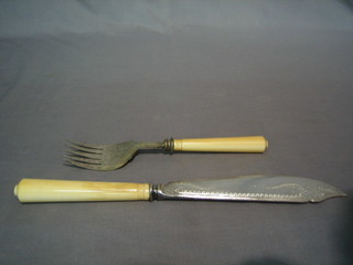 A pair of silver plated fish servers with ivory handles