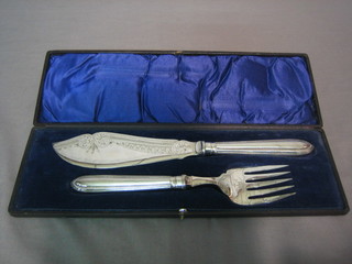 A pair of silver plated fish servers, cased