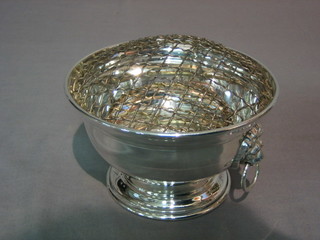 A modern silver rose bowl with lion mask handles, raised on a spreading foot, 9 ozs inscribed 