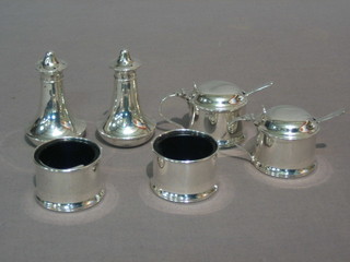 A matched silver 6 piece condiment set comprising pair of mustard pots, pair of salts and pair of peppers, 3 ozs