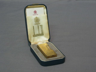 A Dunhill gold plated lighter, cased