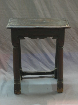 An 18th/19th Century oak stool raised on turned and block supports (1 stretcher f) 17"
