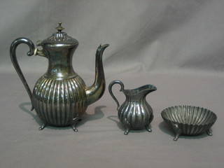 A 3 piece Britannia metal coffee service with demi-reeded decoration comprising coffee pot, sugar bowl and cream jug
