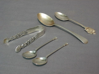 A silver teaspoon decorated the badge of the Metropolitan Police, 2 other silver teaspoons and a pair of silver sugar tongs 2 ozs