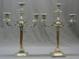 A handsome pair of Edwardian Adam style silver plated 3 light candelabrum with fluted and reeded columns and Corinthian capitals