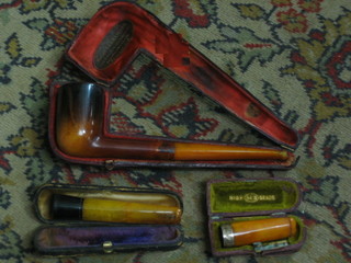 A pipe and 2 cheroot holders
